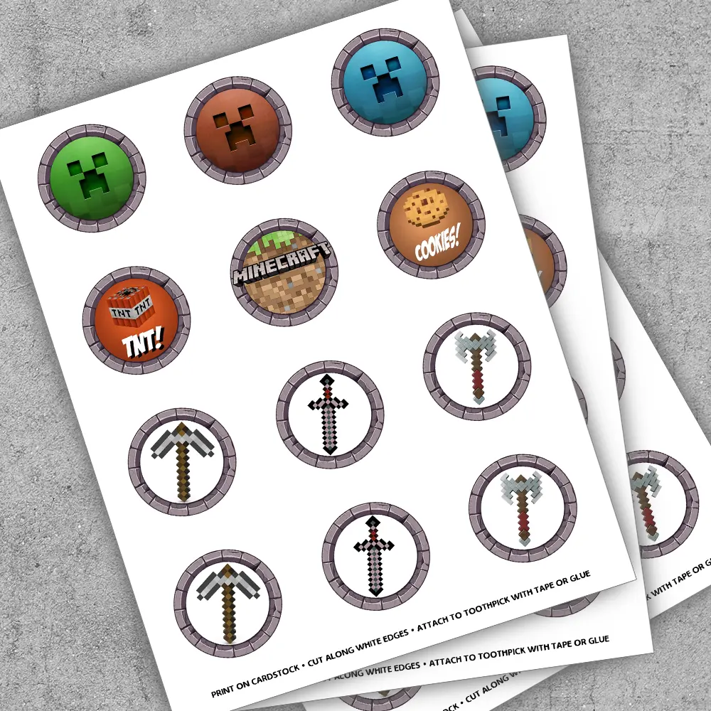 Close-up of 2-inch Minecraft round toppers with creeper and sword designs