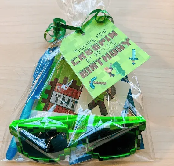 Close-up of diamond candy packs and pixel tattoos inside Creeper favor bags