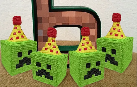 Creeper piñata: green pixel-style square piñata as party centerpiece